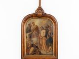 painting of a cross hanging on a wall above a painting of jesus