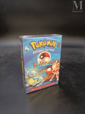 a box of pokemon trading cards sitting on a table