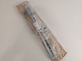 a toothbrush that is wrapped in plastic on a table