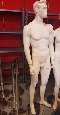 three mannequins that are standing in a room