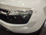 a close up of the front of a white truck