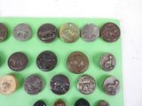 a lot of coins that are on a green tray