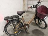 a bicycle with a basket attached to the back of it