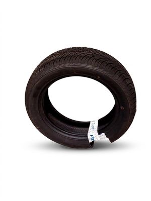 a tire that is sitting on a white surface