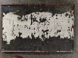 a person standing next to a piece of metal on the ground