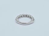a close up of a silver ring on a white surface