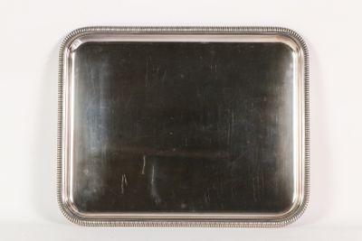 rectangular silver plate with beaded edge on a white background