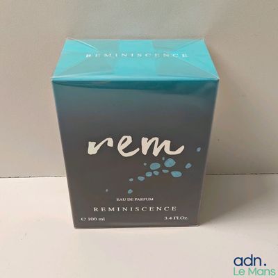 an image of a box of perfume sitting on a table