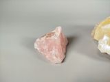 two pieces of rock sitting next to each other on a table