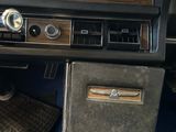 a dashboard of a car with a radio and a keyboard