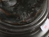 a close up of a metal object with a tag on it