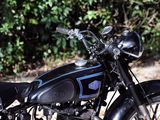 a black motorcycle parked on the side of the road