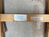 a close up of a piece of wood with a label on it
