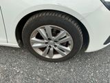 a close up of a tire on a white car