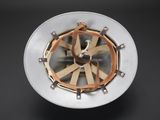 a clock that is made of metal and wood
