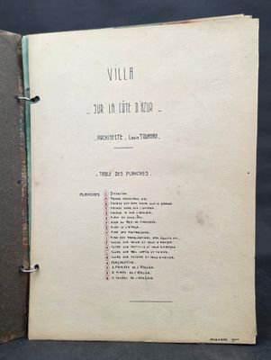 an old book opened to show a list of items on a table