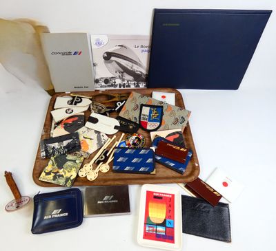 a wooden tray filled with assorted items on a white table