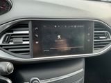 the dashboard of a car with a digital display in the center of it