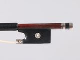 a close up of a violin bow with a string attached to it