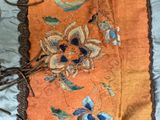 a close up of a piece of cloth with flowers on it