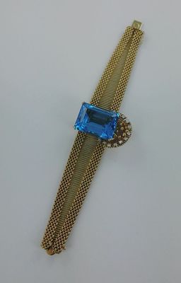 Bracelet souple or 585 millièmes serti d'une importante topa…