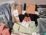 a pile of clothing that is sitting on top of a table