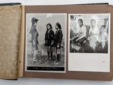 a book with pictures of people in it on a table