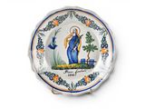 a plate with a picture of a woman on it