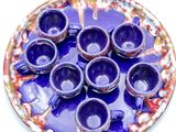 a plate that has a bunch of cups on it