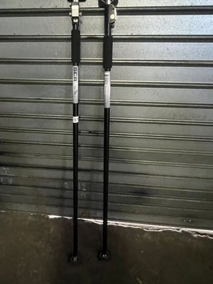 two poles that are standing next to each other in front of a garage door