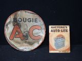 une assiette sur laquelle est représentée une batterie de voiture et une boîte de piles