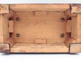a small wooden box with a picture inside of it