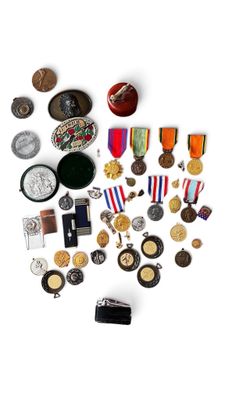 a lot of medals and medals on a white surface