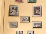 a picture of a collection of stamps displayed on a wall