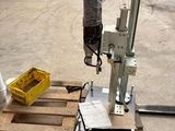 a machine that is sitting on a pallet in a warehouse