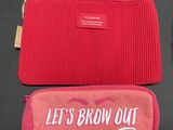 a red bag with a pink pouch and a red bag with the words let ' s brow out on it