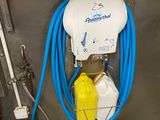 a blue hose attached to a white bucket