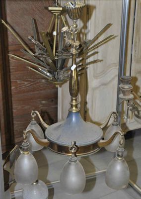 a silver and gold chandelier with glass lamps on it