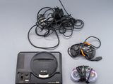 a video game console and other electronics on a table