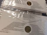 two envelopes that are sitting on top of each other