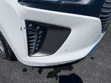a close up of the front of a white car