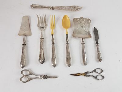 many different types of silverware on the table