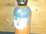 a fire extinguisor sitting on the floor in a room