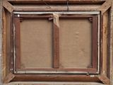 an old picture frame with a picture hanging on the wall