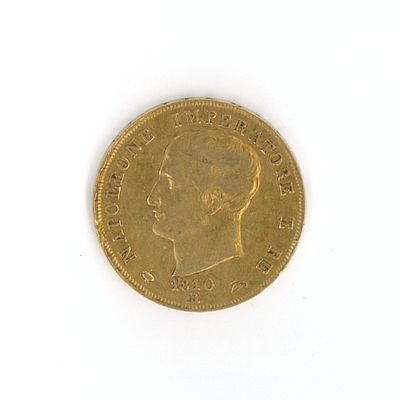 a gold coin with a picture of a man ' s face on it