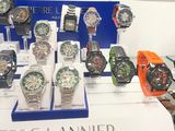 many watches on display on a table in a store