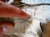 a person that has a piece of fabric on a piece of cloth
