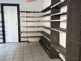 a empty store with empty shelves in the middle of the room