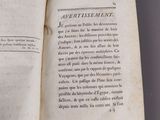 an open book with a black and white image of a bird on it