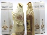 three bottles of wine sitting next to each other on a table